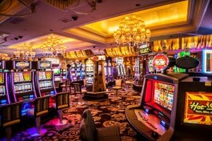 Rows of illuminated slot machines representing sweepstakes casino slot games